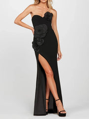 Black strapless gown with floral details on a white background