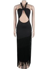 Black evening gown with cut-out design on a mannequin against a white background