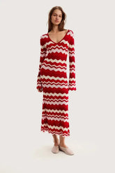 Red chevron knit maxi dress with V-neck and flared long sleeves
