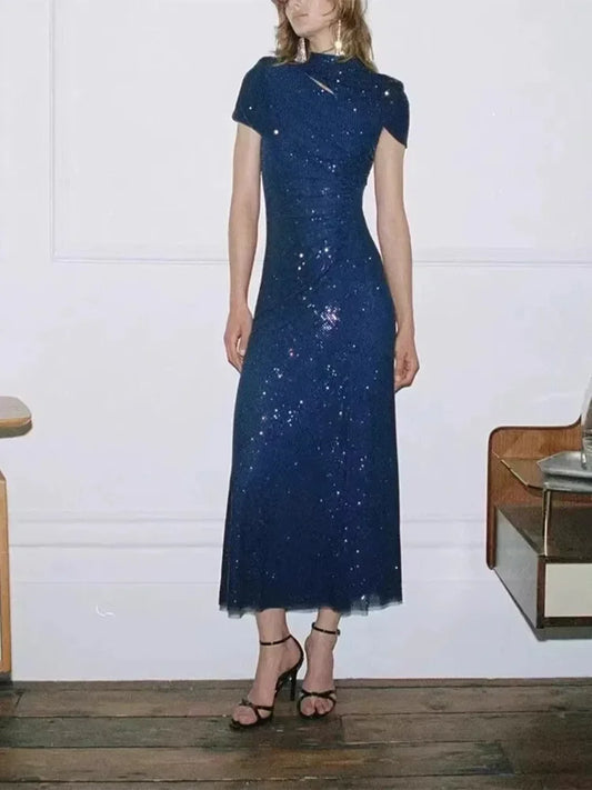 Dark blue sequin midi dress with a high neckline and cut-out detail.