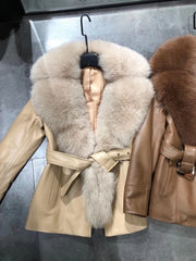 Two leather jackets with fur collars on a metallic surface