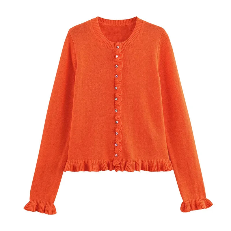 Orange sweater with buttons on a white background
