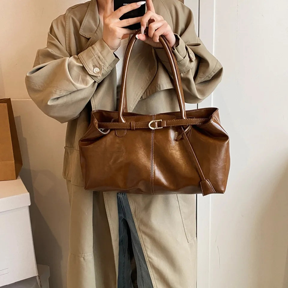 Glossy faux leather top-handle tote bag in brown