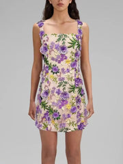 Floral dress with purple flowers on a gray background