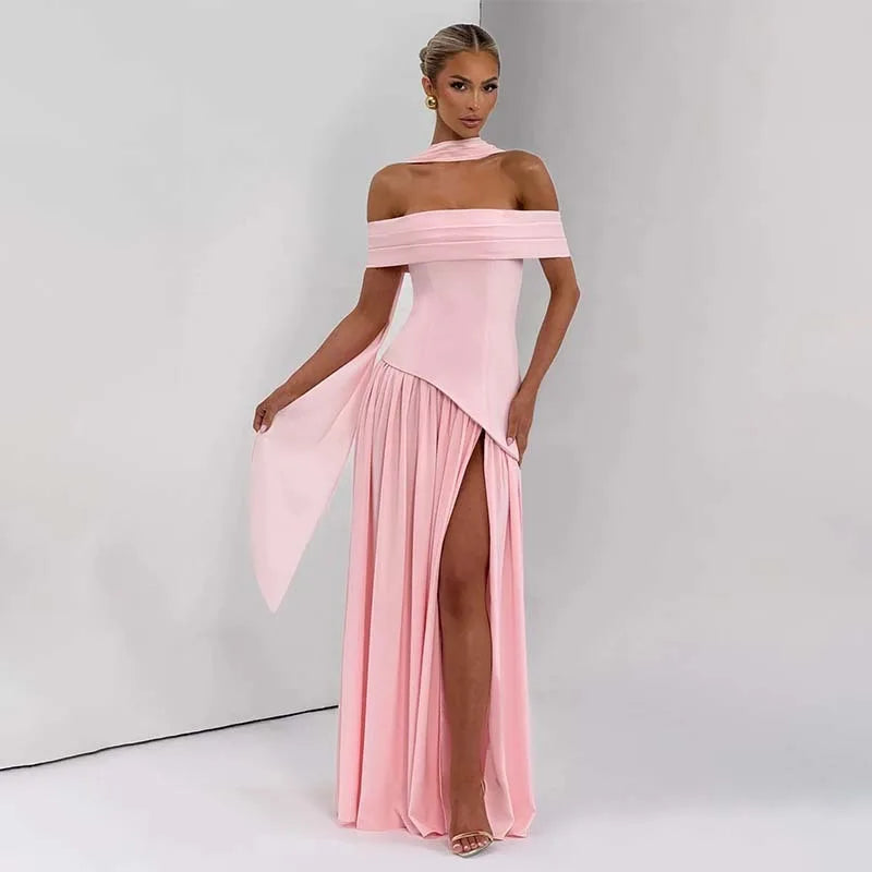 Woman wearing a pink off-shoulder dress with a slit