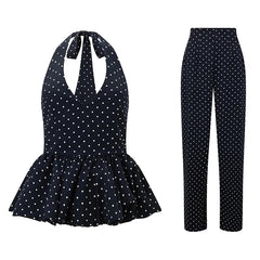 Navy polka dot jumpsuit with peplum top and flared pants on a white background