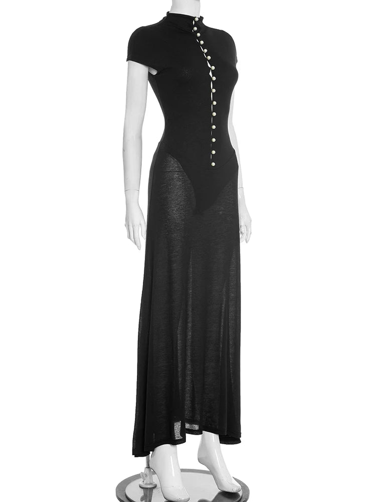 Black dress on a mannequin against a white background
