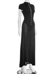 Black dress on a mannequin against a white background