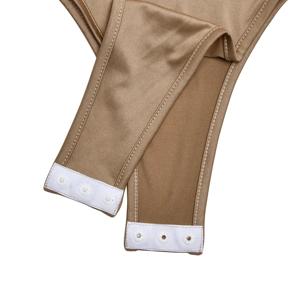 Close-up of beige pants with white trim on a white background