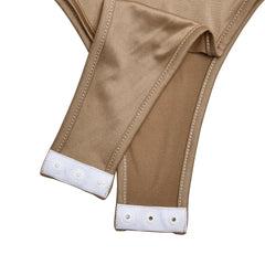 Close-up of beige pants with white trim on a white background