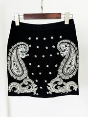 Close-up of embellished mini skirt with paisley and star details