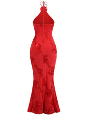 Red evening gown with floral embroidery on a white background
