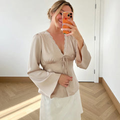 Beige satin lace trim tie-front blouse with bell sleeves