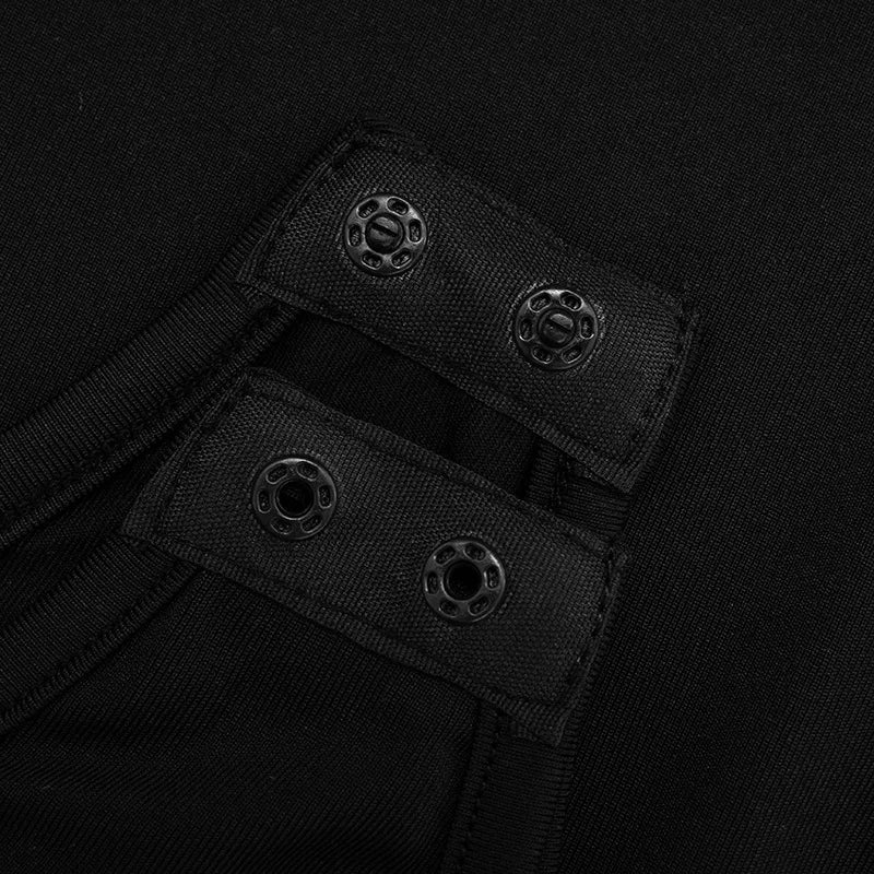 Close-up of black fabric with button-like texture on a dark background