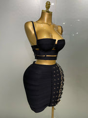 Black outfit on a mannequin against a plain background