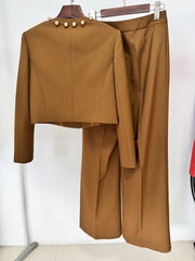 Brown cropped jacket and wide-leg trousers displayed on hangers, back view.