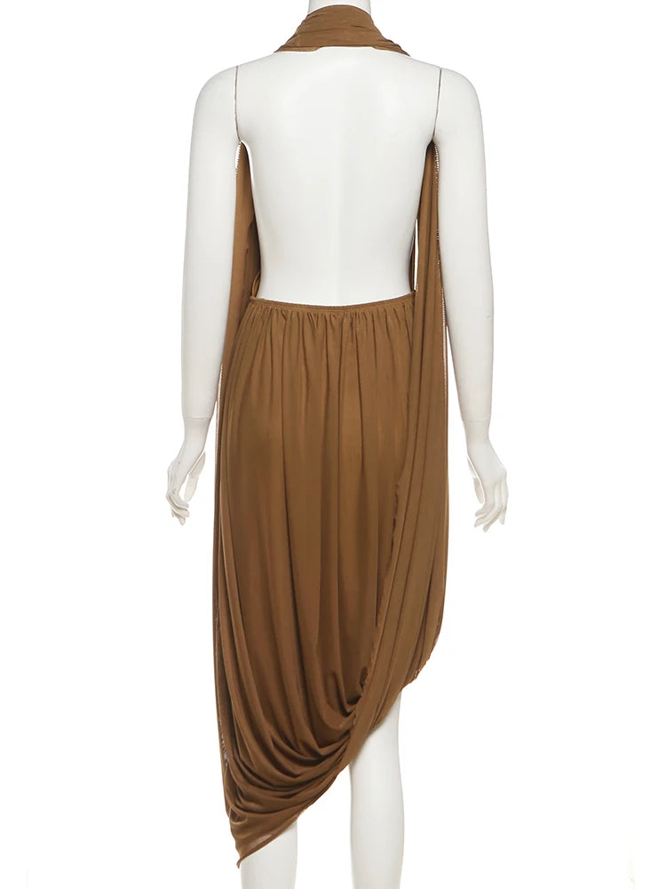 Brown draped dress on a mannequin against a white background
