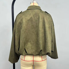 Green jacket on a mannequin with a plain background
