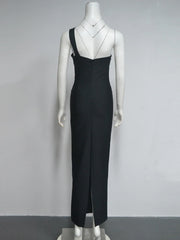 Black evening gown on a mannequin against a gray background