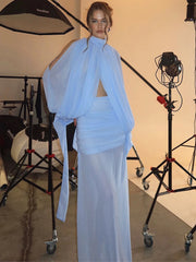 Blue turtleneck mesh top with draped sleeves and ruched maxi skirt set