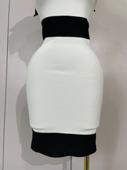White and black two-tone skirt on a mannequin against a plain background