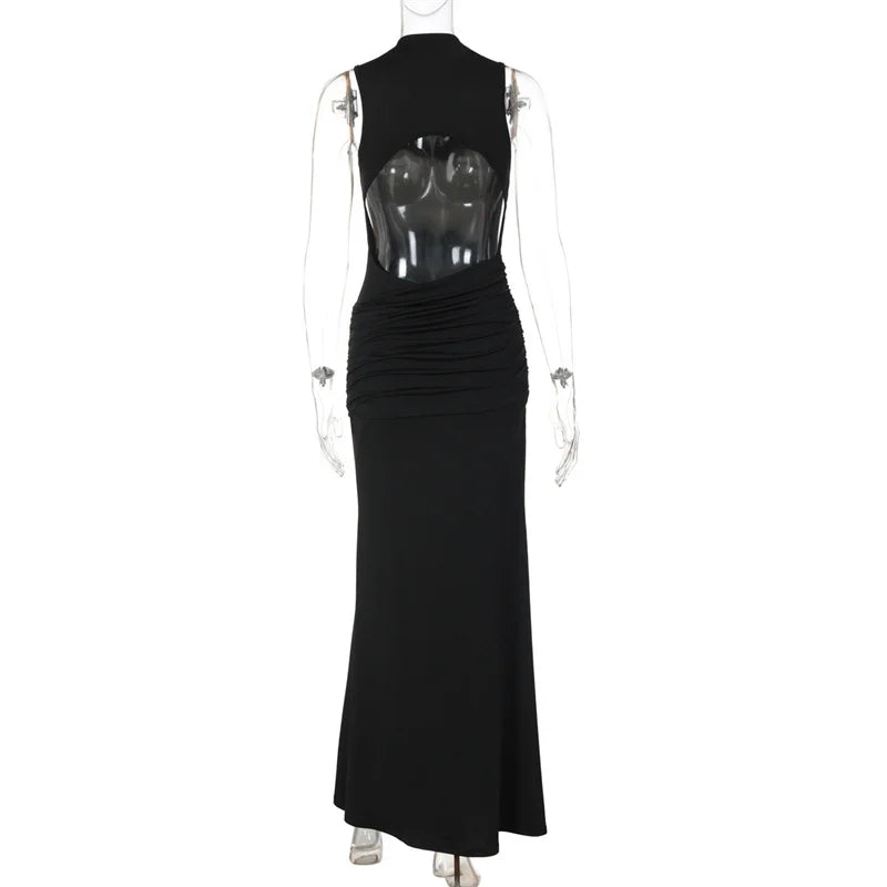 Black evening gown with sheer back on a mannequin against a white background