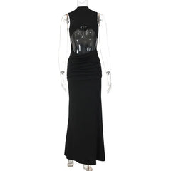 Black evening gown with sheer back on a mannequin against a white background