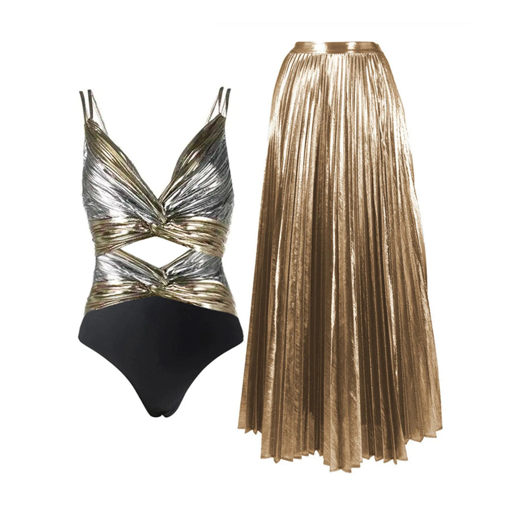 Metallic silver and gold twisted one-piece swimsuit with a cutout detail, paired with a gold pleated maxi skirt
