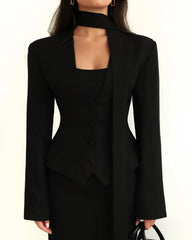 Black suit with cut-out design on a white background