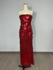 Red sequin strapless gown on a mannequin against a plain background