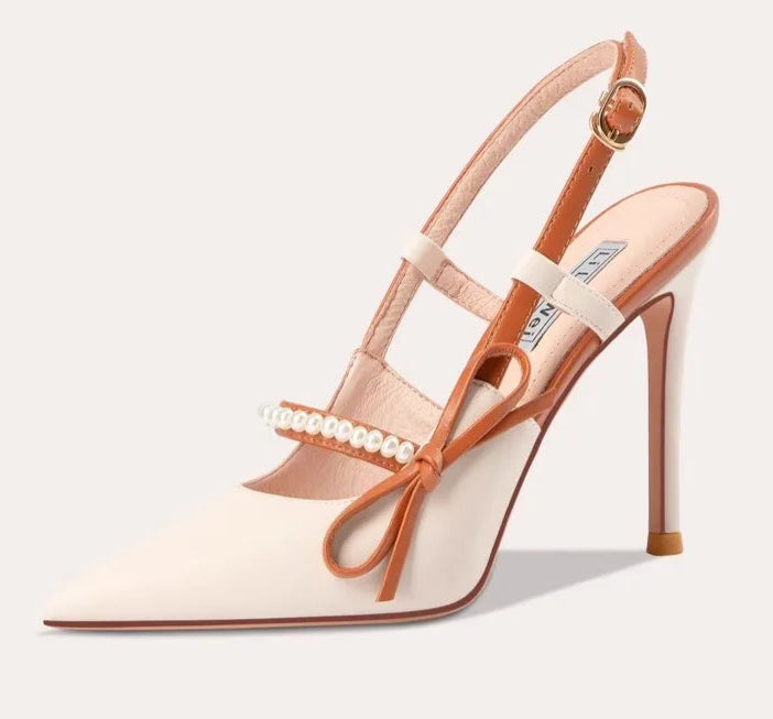 High-heeled sandal with bow detail on a white background