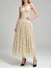 Lace A-line midi dress with hand on hip in cream