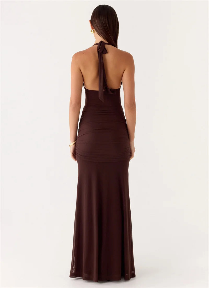 Brown halter neck dress on a white background