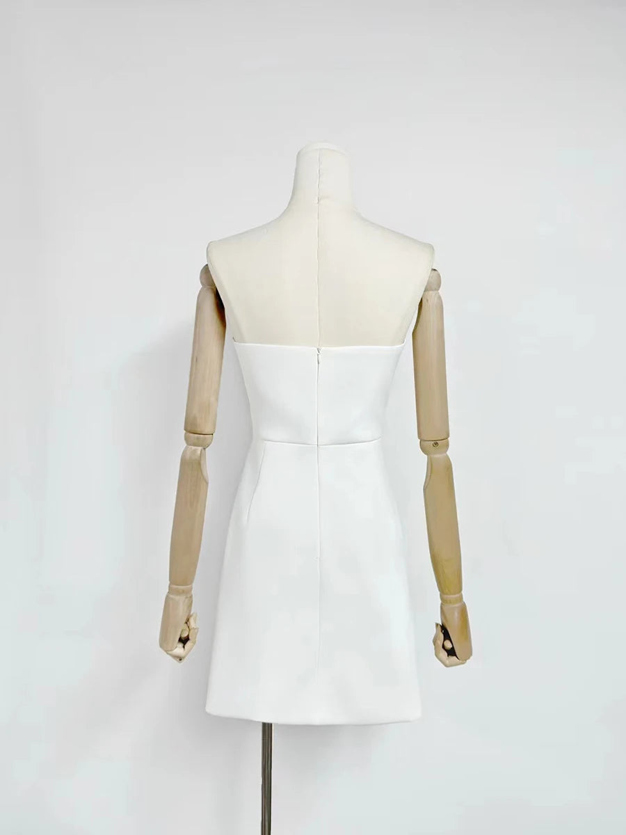 White dress on a mannequin against a white background