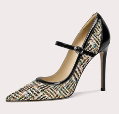 High-heeled shoe with patterned design on a white background