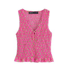 Pink floral sleeveless top on a white background