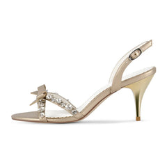 Side view of gold crystal bow slingback stiletto sandals