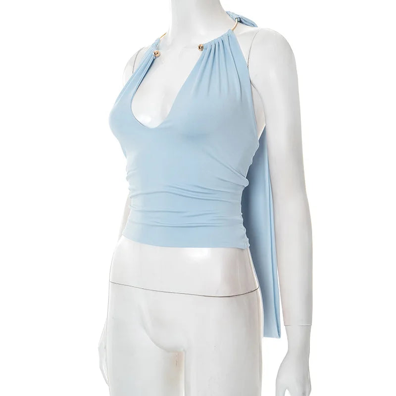 Light blue halter top on a mannequin with a white background