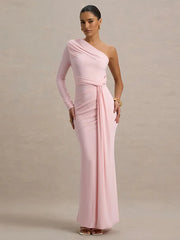 Woman wearing a pink one-shoulder gown against a plain background