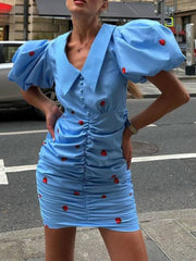 Puff sleeve ruched mini dress with a turn-down collar.