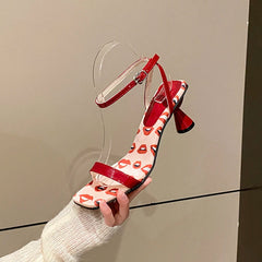 Red and white lip print ankle strap heels