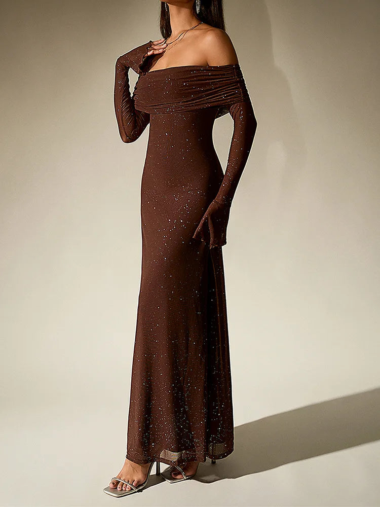 Brown off-shoulder evening gown on a plain background