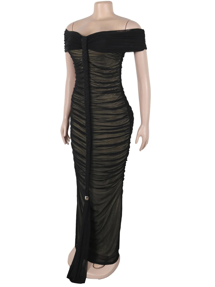 Black off-shoulder dress on a mannequin against a white background