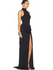 Side profile of black mock neck high slit maxi dress
