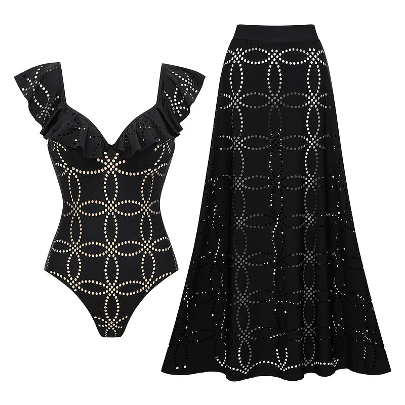 Black one-piece swimsuit and matching maxi skirt laid out flat.