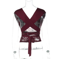 Maroon top with lace detailing on a mannequin against a white background