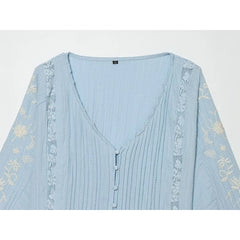 Detail of Embroidered V-Neck Pleated Blouse neckline