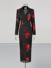 Black dress with red floral patterns on a mannequin against a white background
