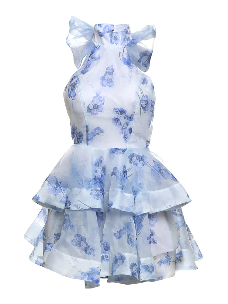 White dress with blue floral patterns on a white background
