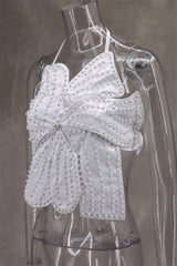 White lace top on a transparent mannequin against a gray background